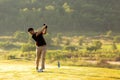 Golfer sport course golf ball fairway.ÃÂ  People lifestyle man playing game golf tee off on the green grass.ÃÂ  Royalty Free Stock Photo